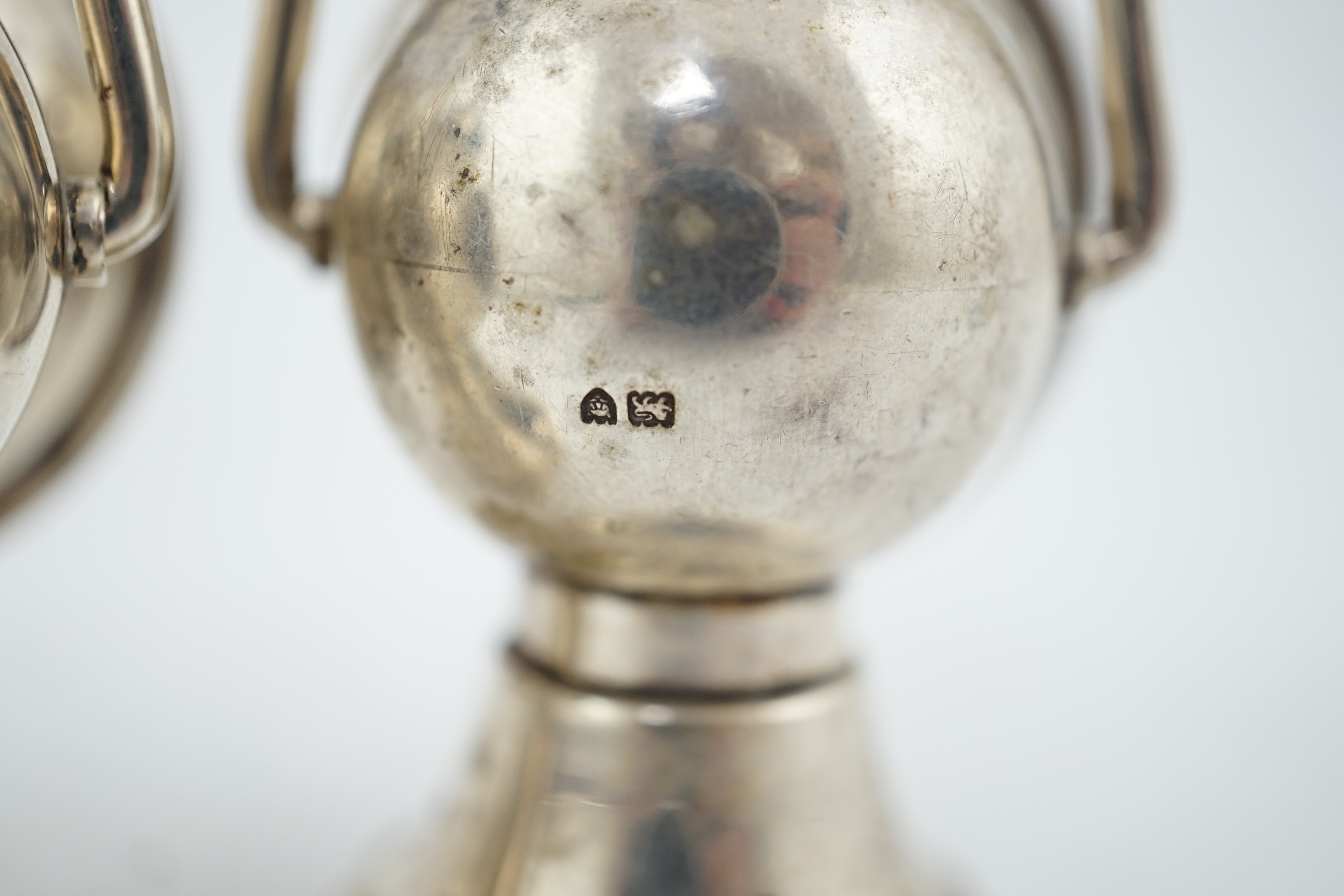 An Edwardian novelty cigar cutter and perpetual lighter, modelled as a pair of railway lamps, by Walker & Hall